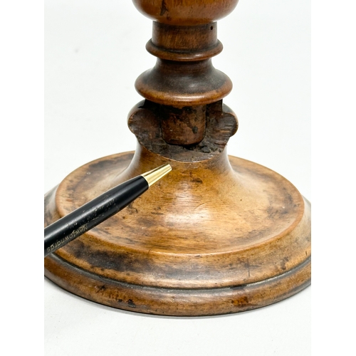 556 - A pair of Late 19th Century Victorian turned pearwood/fruitwood candlsticks. 26cm