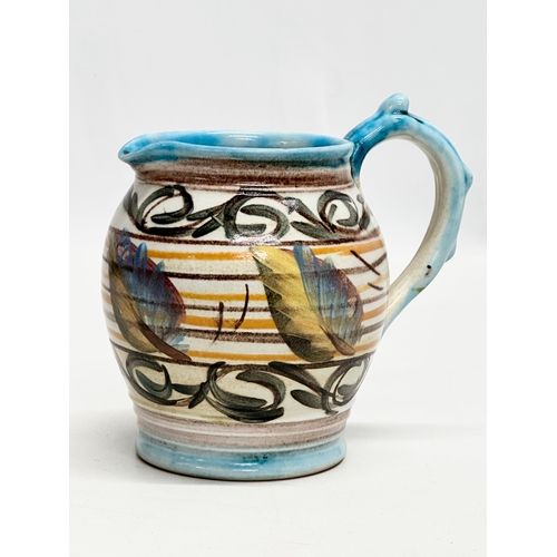 557 - Glyn Colledge. A vintage hand painted glazed stoneware jug by Glyn Colledge for Denby. 13x10x13cm