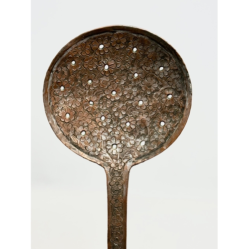 558 - An Early 20th Century Indian copper skillet. 42cm.