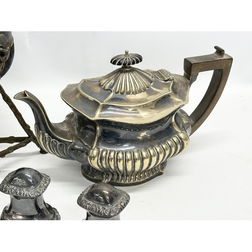 561 - A quantity of 19th and 20th Century silver plate. Spirit kettle, 2 teapots, large salts and salt and... 