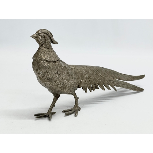 562 - A pair of large silver plated pheasants. 27cm