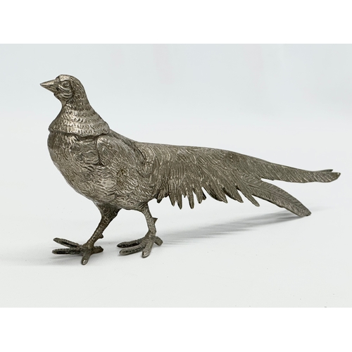 562 - A pair of large silver plated pheasants. 27cm