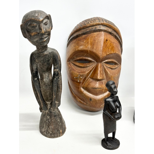 565 - A collection of large African busts and figures. 94cm. 40cm. 37cm etc.