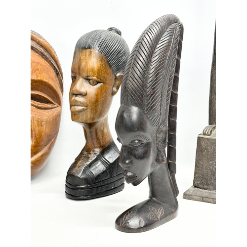 565 - A collection of large African busts and figures. 94cm. 40cm. 37cm etc.