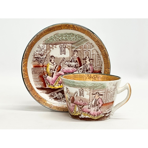 257 - A large Mid 19th Century Victorian Chinese style cup and saucer. Saucer 16cm.