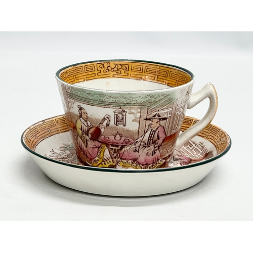 257 - A large Mid 19th Century Victorian Chinese style cup and saucer. Saucer 16cm.