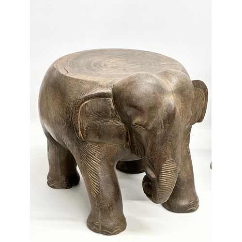 260 - A pair of African elephant stools/plantstands. 33x41x34cm.