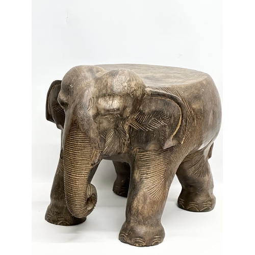 260 - A pair of African elephant stools/plantstands. 33x41x34cm.