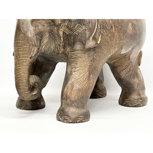 260 - A pair of African elephant stools/plantstands. 33x41x34cm.