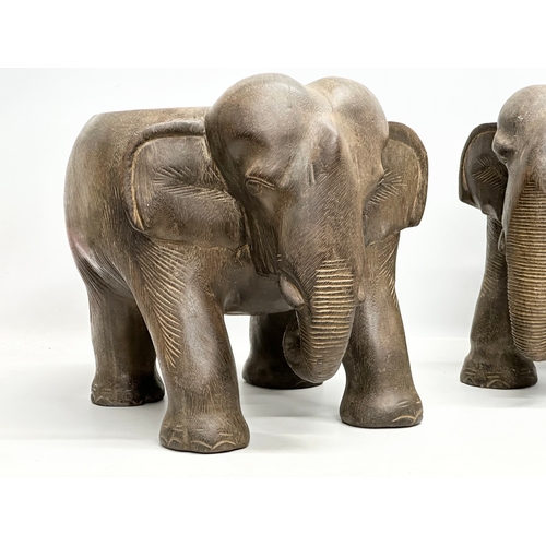 260 - A pair of African elephant stools/plantstands. 33x41x34cm.