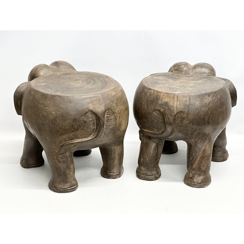 260 - A pair of African elephant stools/plantstands. 33x41x34cm.