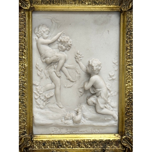 262 - A set of 4 Late 20th Century gilt framed wall plaques with carved cherub panels. Marked P.T. Seymour... 