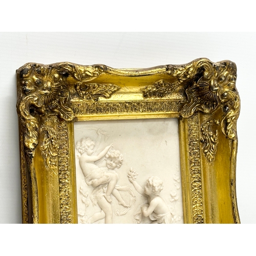 262 - A set of 4 Late 20th Century gilt framed wall plaques with carved cherub panels. Marked P.T. Seymour... 