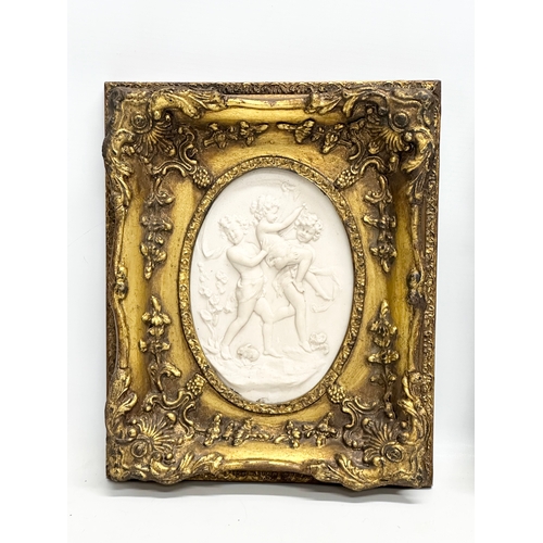 262 - A set of 4 Late 20th Century gilt framed wall plaques with carved cherub panels. Marked P.T. Seymour... 