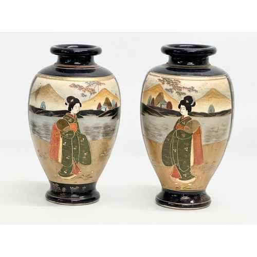 573 - A pair of signed Early 20th Century Japanese baluster vases by Satsuma. 18x32cm.