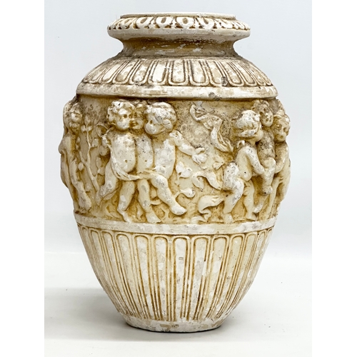 574 - A pair of Mid 20th Century moulded relief cherub vases. 21x30cm