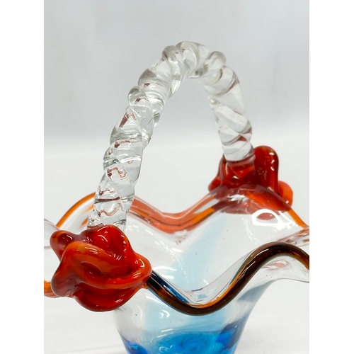 577 - A Mid 20th Century art glass basket. 15x12x13cm.