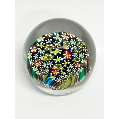 270 - A Murano Glass Millefiori paperweight. 6x5cm