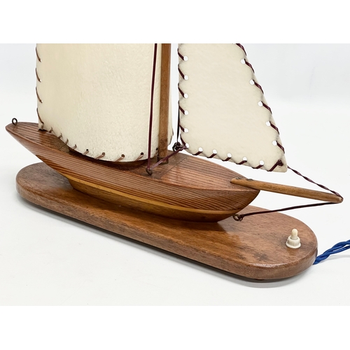 194 - A 1950’s wooden yacht table lamp. 38x41cm