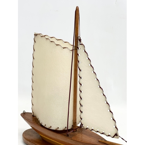 194 - A 1950’s wooden yacht table lamp. 38x41cm