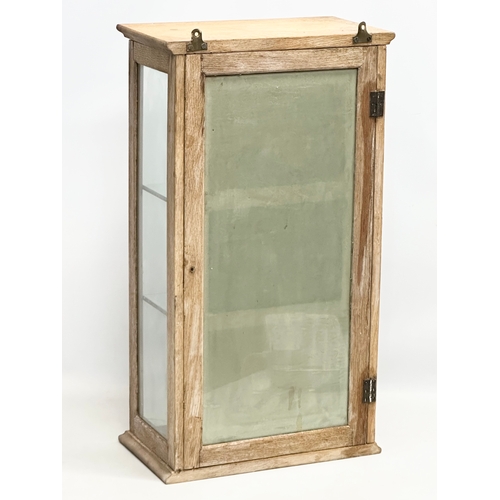 45 - A Late 19th Century Victorian limed oak tabletop display cabinet. With 3 coloured etchings of fish a... 