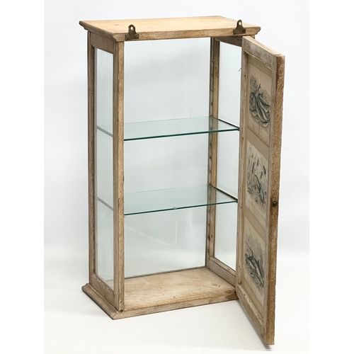 45 - A Late 19th Century Victorian limed oak tabletop display cabinet. With 3 coloured etchings of fish a... 