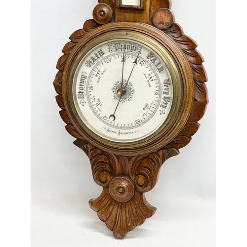 280 - A Late 19th Century Victorian oak barometer. 31x88cm