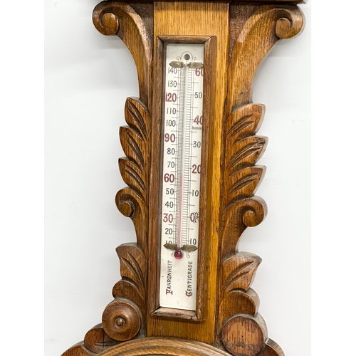 280 - A Late 19th Century Victorian oak barometer. 31x88cm