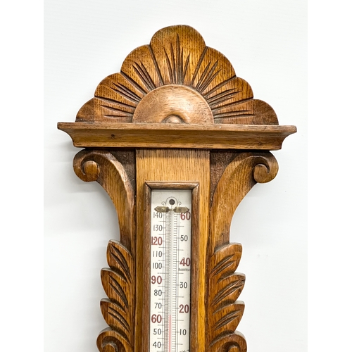 280 - A Late 19th Century Victorian oak barometer. 31x88cm