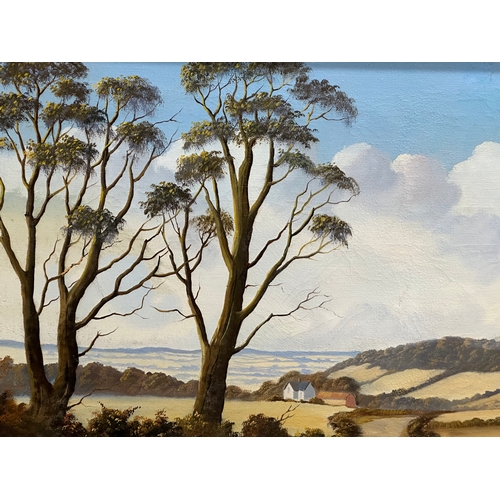 286 - Robert B. Higgins. A large oil on canvas. Country Lane. Scrabo Tower. 91x61cm. Frame 111x80cm.