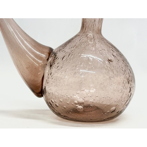 592 - A French controlled bubble glass carafe and stopper. 24x26cm.