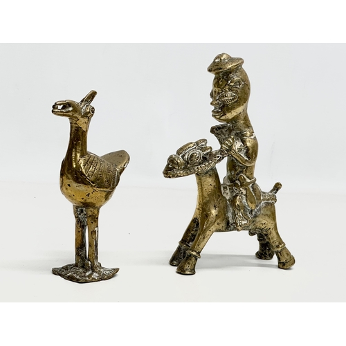 296 - A Late 19th Century African brass rider and bird. 21cm. 18cm.