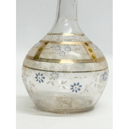 627 - A 19th Century Victorian glass decanter. With embossed paintwork. 24cm