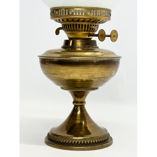 632 - A Mid 20th Century Victorian style brass double burner oil lamp. 47cm