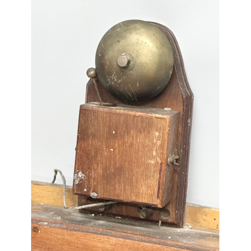 635 - An Early 20th Century wall mounted servants bell. 34x45cm