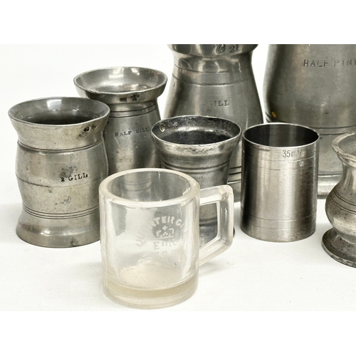 297 - A collection of 19th Century pewter measures/gills.