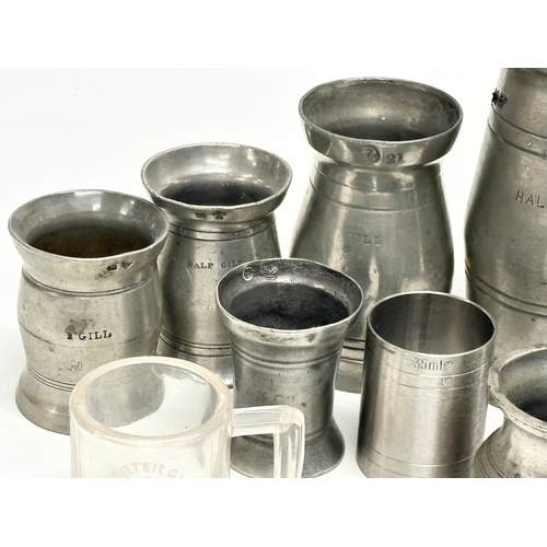 297 - A collection of 19th Century pewter measures/gills.