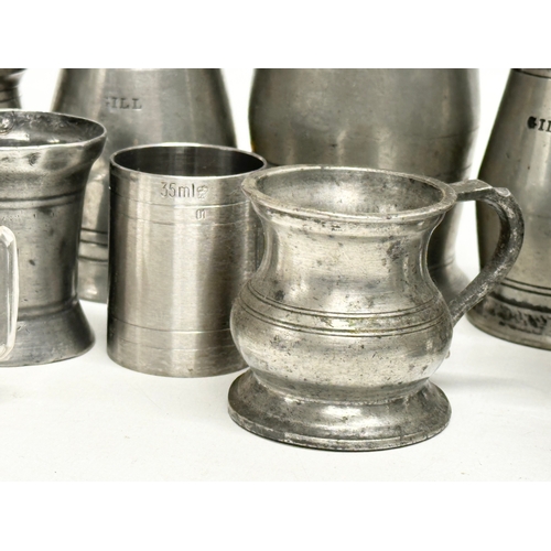 297 - A collection of 19th Century pewter measures/gills.