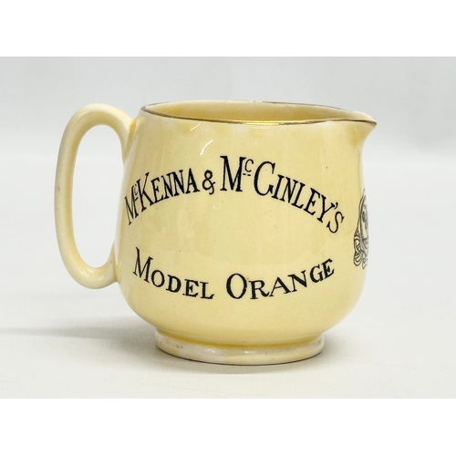 405A - A rare J. A. Campbell & Son McKenna & McGinley’s Model Orange “Antora” Tonic Water jug. 10x7.5x8cm.