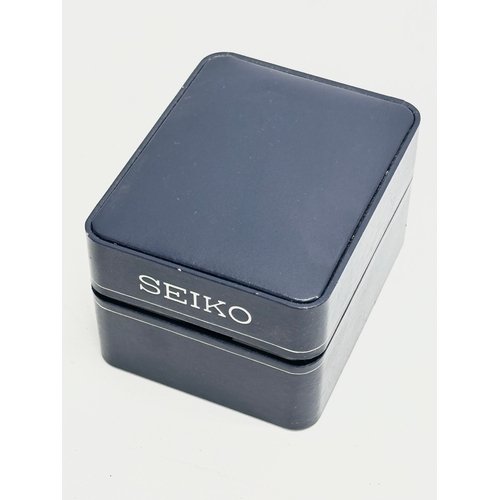 647 - A Seiko watch with case.