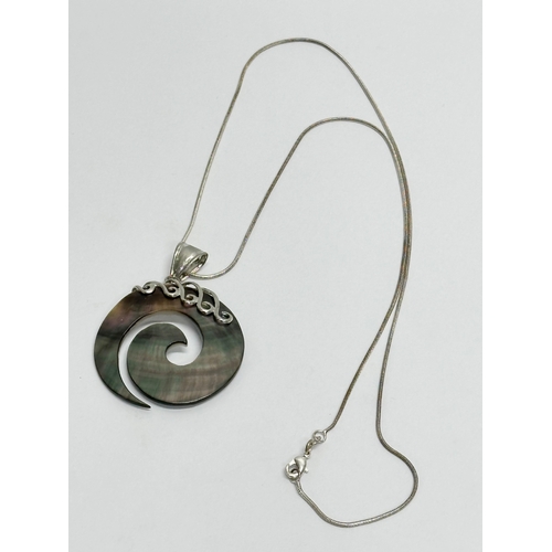 653 - A large silver necklace and 925 silver and pearl style pendant.