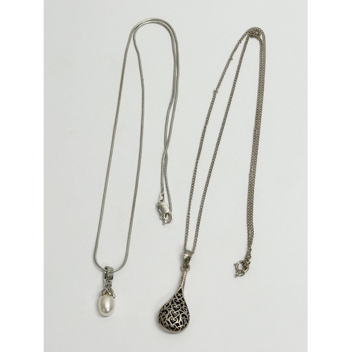 654 - 2 silver necklaces.