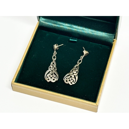 656 - A pair of silver Celtic earrings with case.