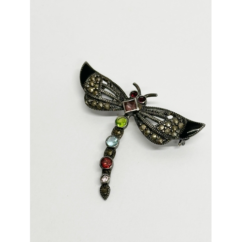 659 - A vintage silver dragonfly brooch with case.