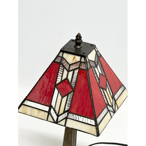 675 - A Tiffany style table lamp. 38cm