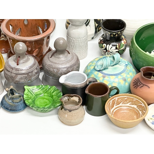 682 - A collection of vintage studio pottery.