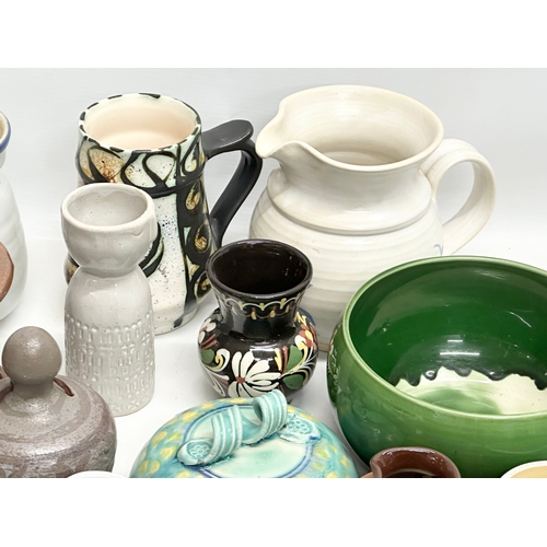 682 - A collection of vintage studio pottery.