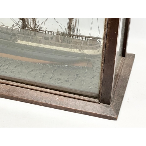 208 - A large 19th Century model ship on display case. 73x30.5x53cm.