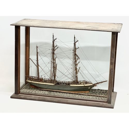 208 - A large 19th Century model ship on display case. 73x30.5x53cm.