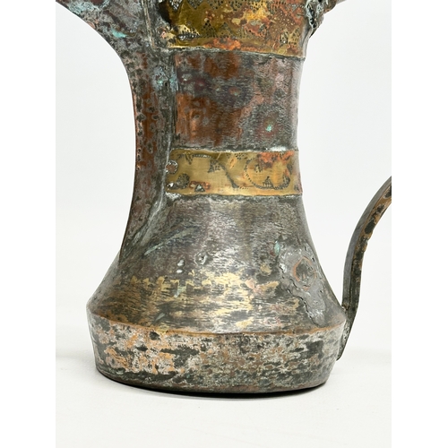 205 - A 18th/Early 19th Century Turkish silvered copper dallah coffee pot with engraved brass banding. 20x... 